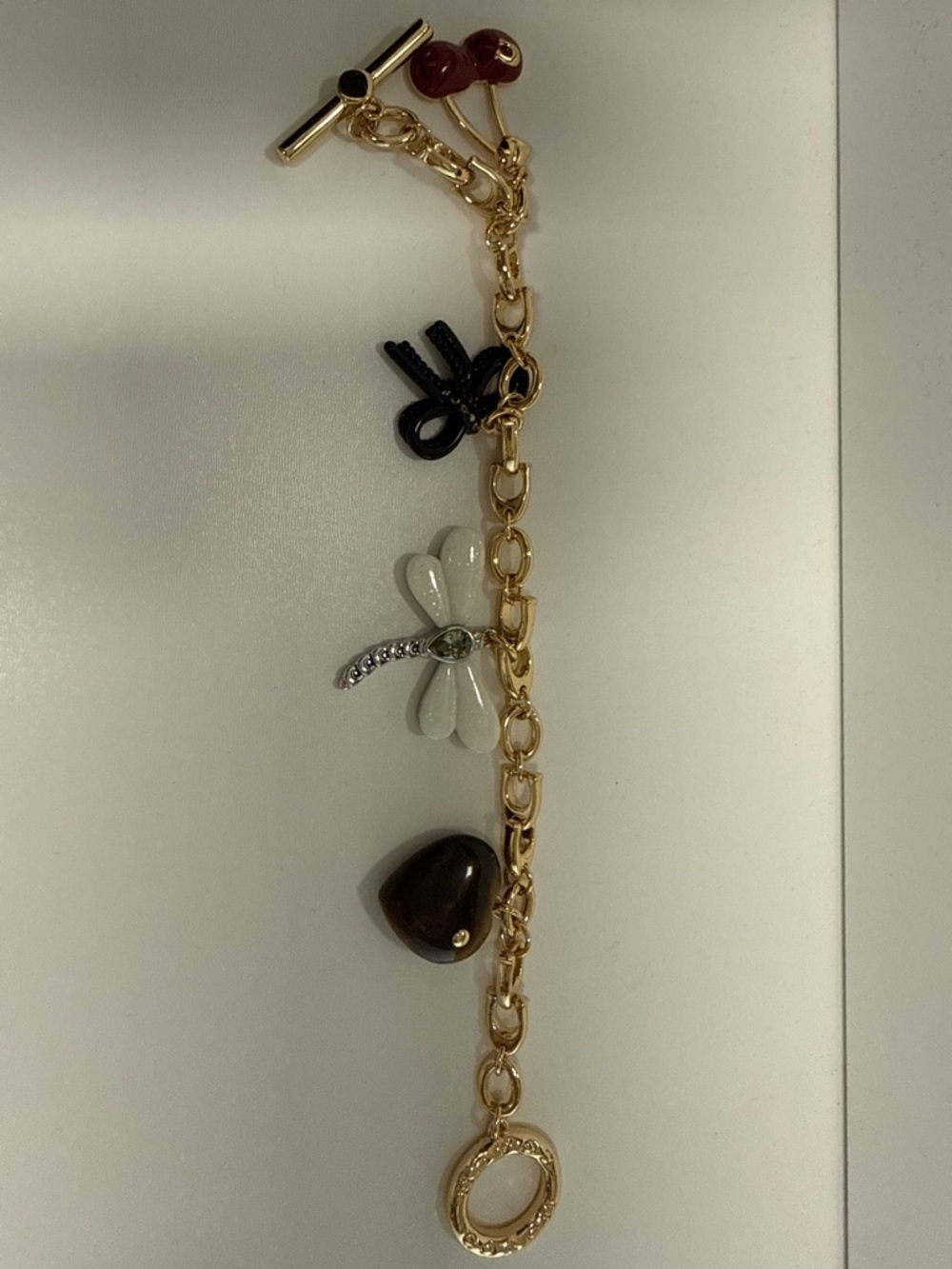 Coach gold-tone Charm Bracelet with White Dragonfly and Brown Heart